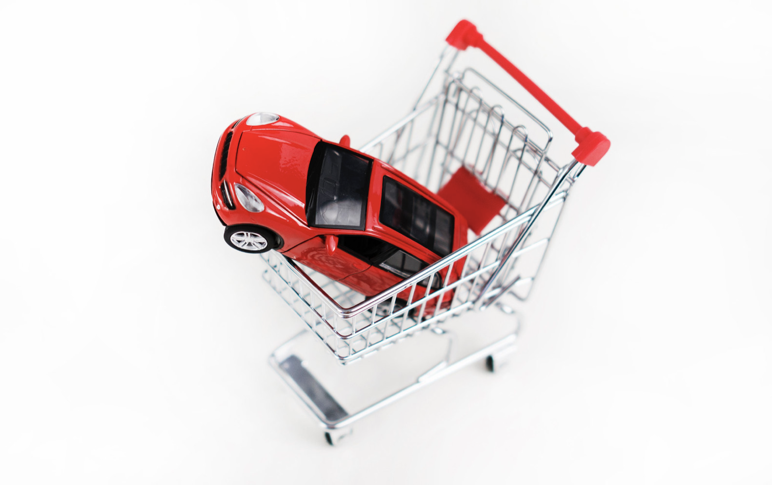 Cartoon of a red car in a shopping trolley